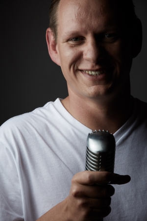 Portrait of a casually dressed young adult caucasian man against a neutral background.の写真素材