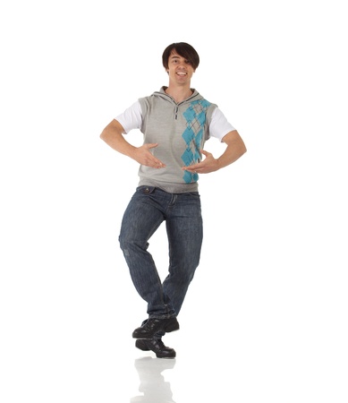 Tap dancer in blue jeans and tap shoes doing steps on a white background and floorの写真素材