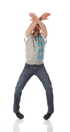 Tap dancer in blue jeans and tap shoes doing steps on a white background and floorの写真素材