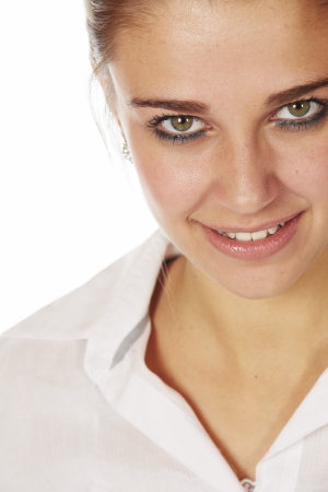 Beautiful young blonde caucasian woman wearing all white and with her hair in a ponytail - On a white backgroundの写真素材