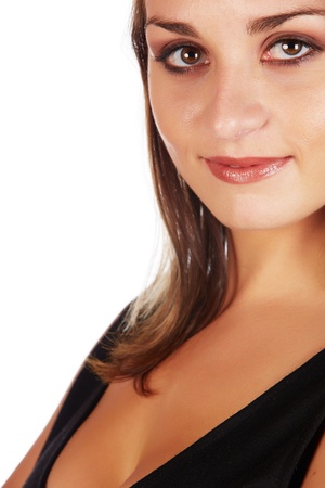 Beautiful and sexy young adult caucasian businesswoman with honey blonde hair wearing a casual white and black business outfit against a white backgroundの写真素材