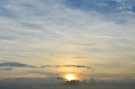 Sun Behind Clouds At Sunrise 