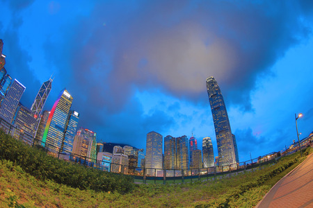 Skyline of Hong Kong at sunset with reflection