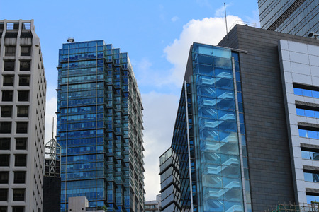 Building reflections of a beautiful cloudy sky