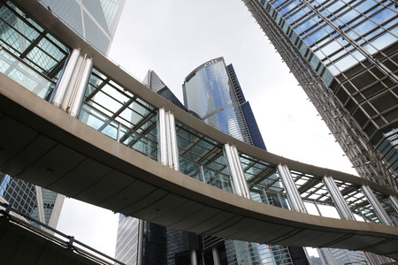 Hong Kong streetscape. Pedestrian passage and tall skyscrapers in Central