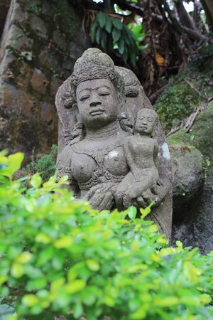 The old stone Buddha statue.