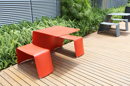 the plastic desk and chair at garden
