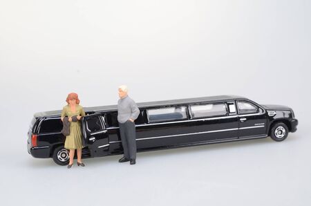 a small figure sit in the toy carの写真素材