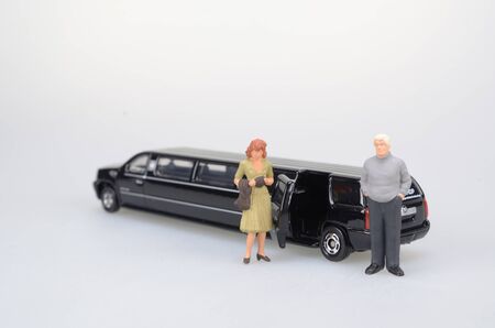 a small figure sit in the toy carの写真素材