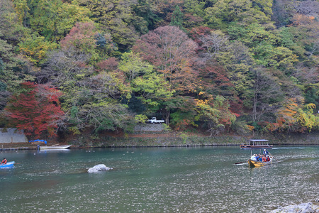 Unidentified people sail boates in the Oi river for touristのeditorial素材
