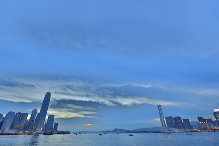a Victoria Harbor with clear sky and urban skyscrapersのeditorial素材