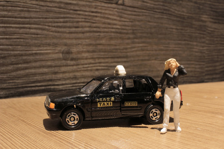 the small figure with the japan taxiの写真素材