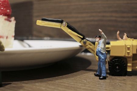 the Group of of tiny miniature artisans working togetherの写真素材