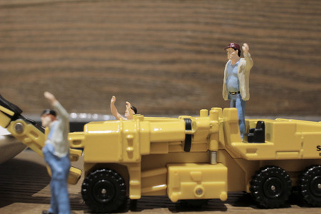 the Miniature figure of technicians workingの写真素材