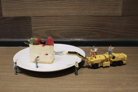 the Group of of tiny miniature artisans working togetherの写真素材