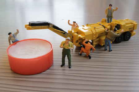 the Miniature figure of technicians workingの写真素材