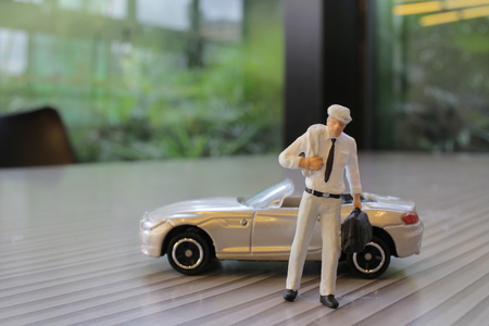 the small figure with the toy sport carの写真素材