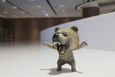 a plastic bear toy on background
