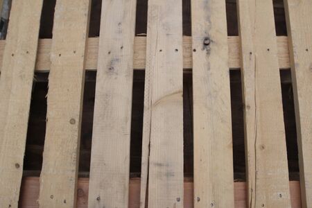 the  old used pallets stacking together in factory