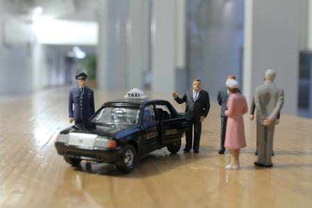 the small business figure with taxiの写真素材