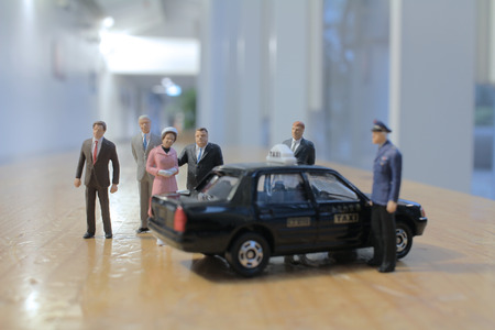 the small business figure with taxiの写真素材