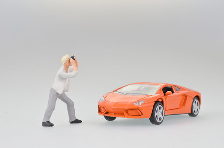 the small figure photographer taking the fun worldの写真素材