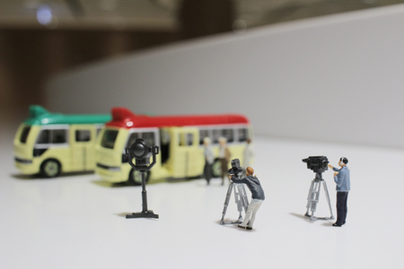the movie making of small figure of minibus stopの写真素材