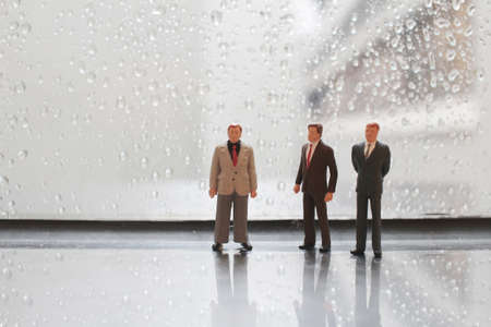 a small business man figure at windowの写真素材