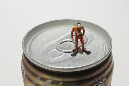 the Divers explore soft drink cansの写真素材