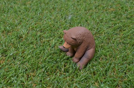 a plastic toy on grass back groundの写真素材