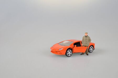 the orange plastic toy car isolatedの写真素材