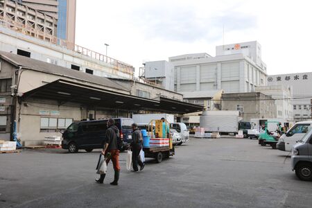 the morning with cars  people and worker driving turret truck.のeditorial素材