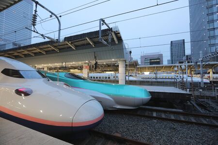 the Green E5 series and white E2 series bullet trains