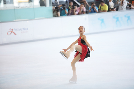the  young skater performs on the iceのeditorial素材