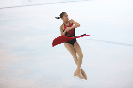 the  young skater performs on the iceのeditorial素材