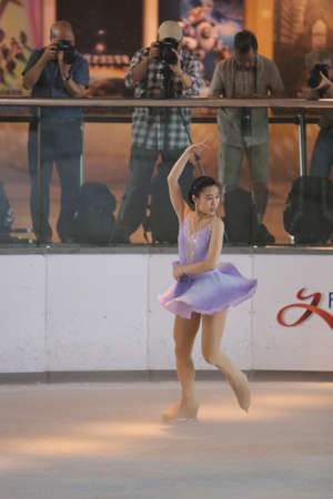 the  young skater performs on the iceのeditorial素材