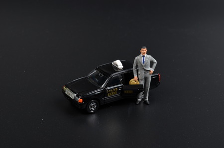 the small figure with the japan taxiの写真素材