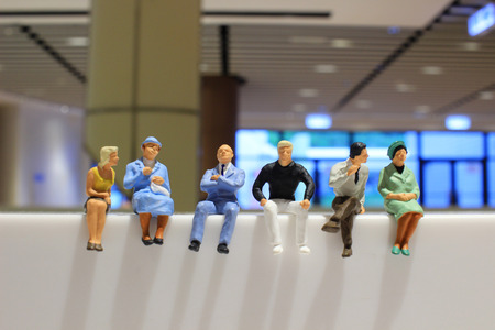 Toy, miniature figures of human in costumes, view from aboveの写真素材