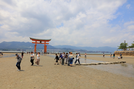 Giant Torii during low tide near Itsukushima shinto shrine in Miyajimaのeditorial素材
