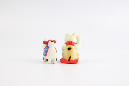 the manekineko and inuhariko isolated on White Backgroundの写真素材