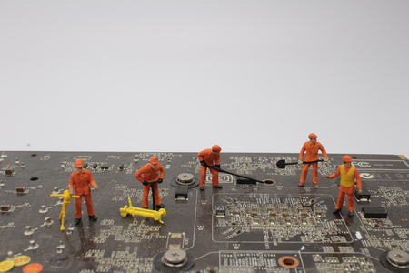 the  mini workers take action on computer board