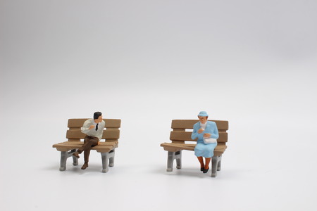 Miniature people business traveler concept sit on chairの写真素材