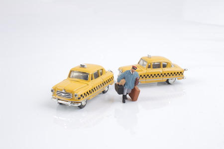 the small figure of taxi with white boardの写真素材