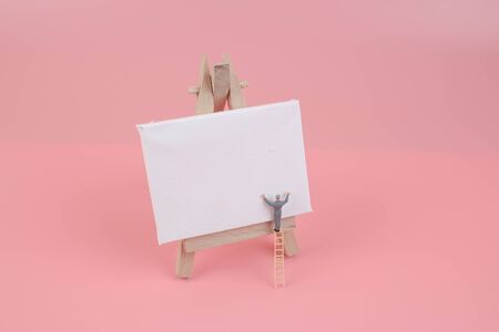the Figurine peasant draw the white boardの写真素材