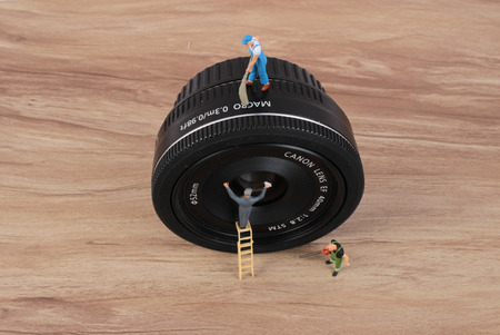 the miniature woker clearing the lensの写真素材