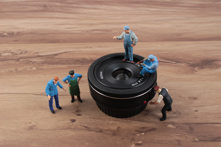 the miniature woker clearing the lensの写真素材