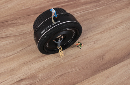 the miniature woker clearing the lensの写真素材