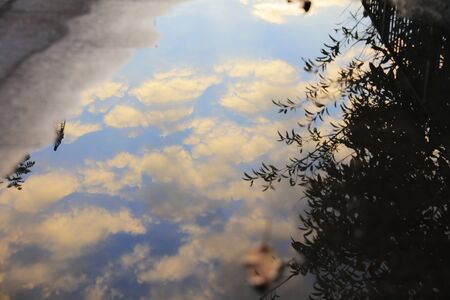 Reflection street  in a puddle on the alley city.の写真素材