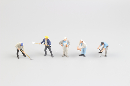 Miniature workers isolate on white background. copy spaceの写真素材