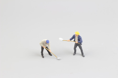 Miniature workers isolate on white background. copy spaceの写真素材